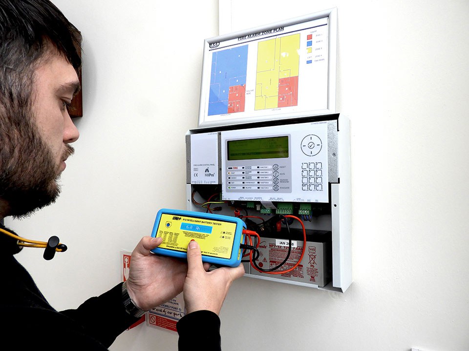 Engineer Testing Fire Alarm Panel